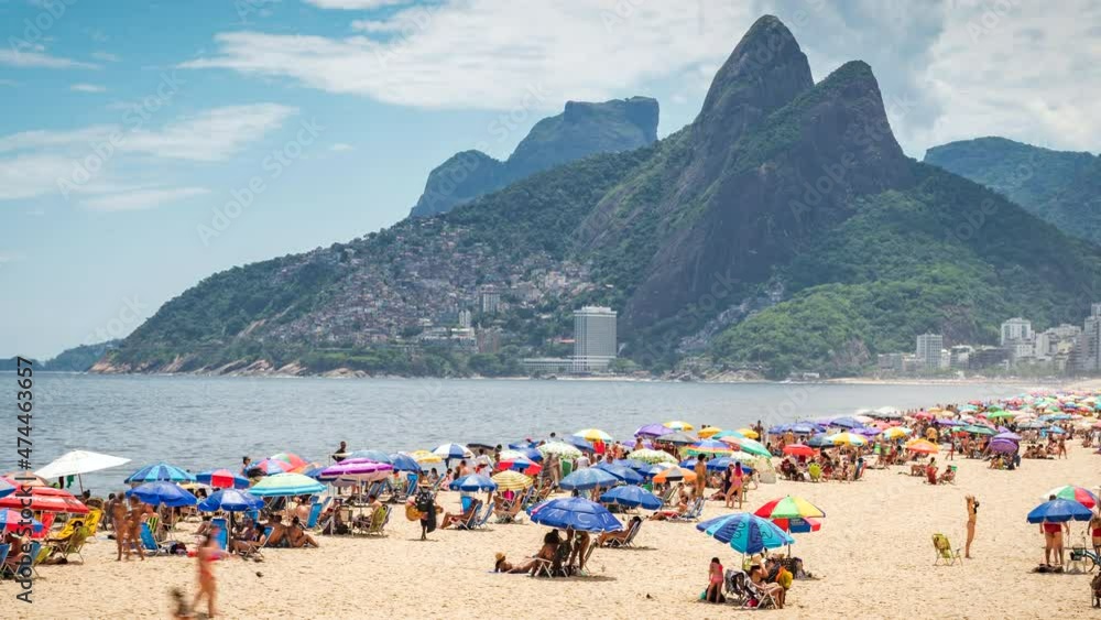 Dolly right time lapse sequence showing people enjoying the summer at famous Ipanema beach in Rio de Janeiro, Brazil. Dolly right time lapse sequence showing people enjoying the summer at famous Ipanema beach in Rio de Janeiro, Brazil.
