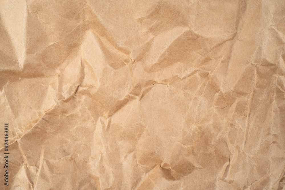 Fototapeta premium Old paper background. Old crumpled vintage paper texture. Paper surface pattern.