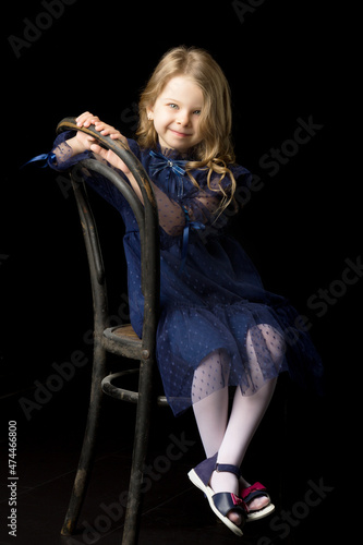 Close up portrait of happy sitting little girl