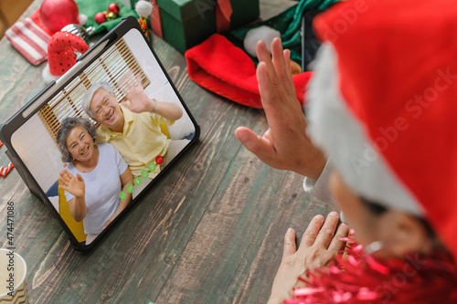 Christmas and new year  video call with famliy with tablet together at home photo