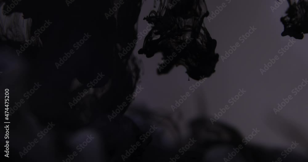 Abstract black ink behind grey background Abstract black ink behind grey background