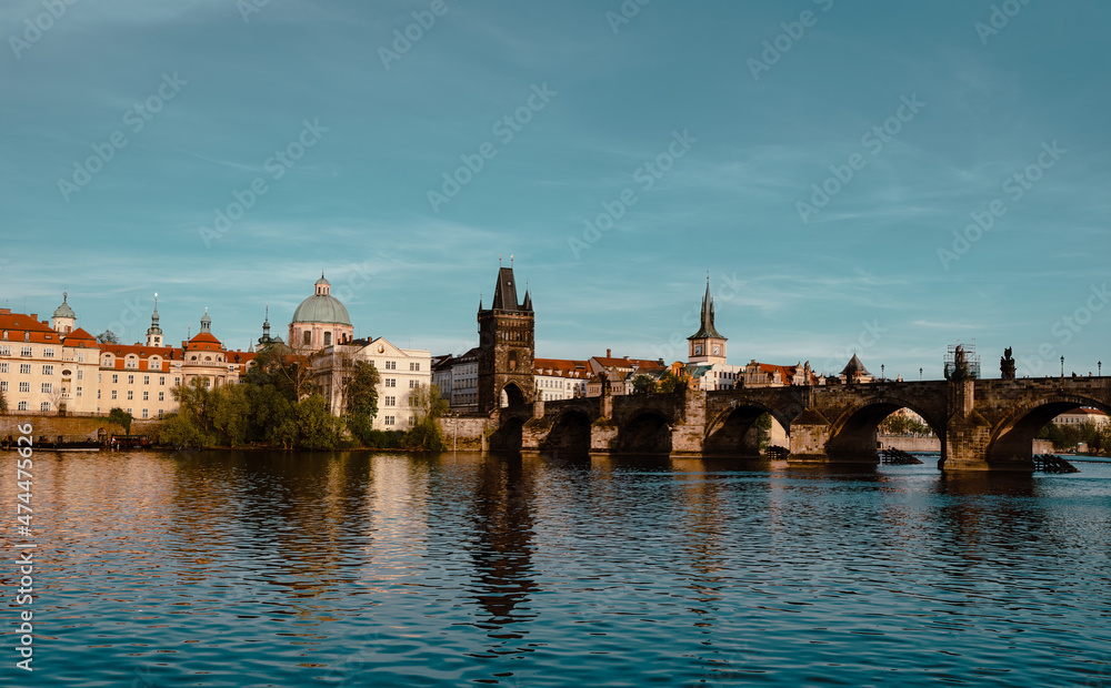 Panoramic view of Charles Bridge on the Vltava river in the center of Prague on a sunny day 2021 during storm