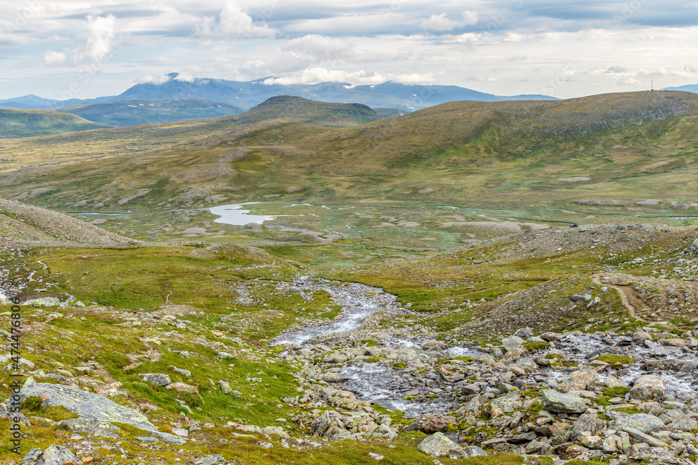 View of a rolling in mountain landscape View of a rolling in mountain landscape