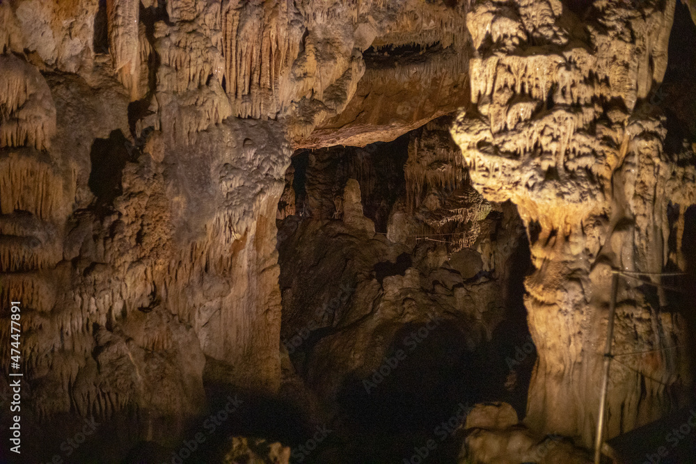 abstract background of stalactites, stalagmites and stalagnates in a cave, underground, horizontal
