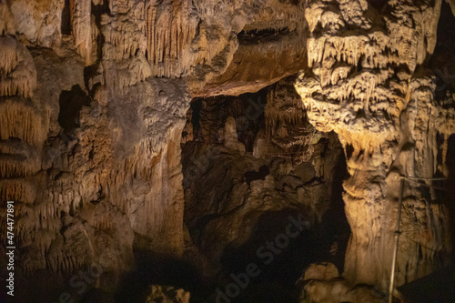 abstract background of stalactites, stalagmites and stalagnates in a cave, underground, horizontal