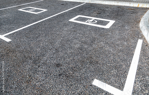 Parking places with handicapped or disabled signs and marking lines