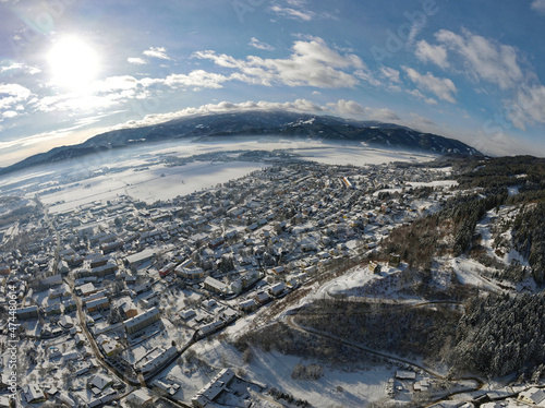 aerial shot of the snow covered village Fohnsdorf in Austria