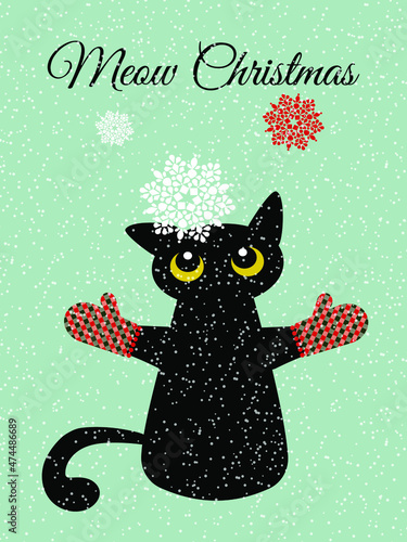 A black cat in checkered mittens looks with curiosity at the snowflakes falling on him. Winter card Happy New Year in flat design style. Vetkor.