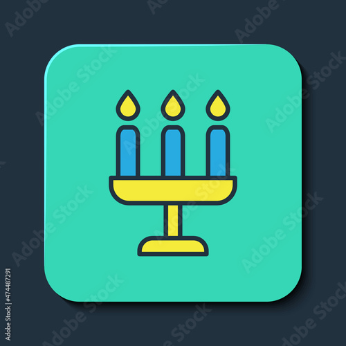 Filled outline Candelabrum with three candlesticks icon isolated on blue background. Turquoise square button. Vector