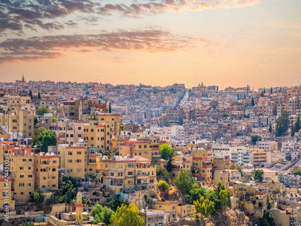 Beautiful view with many apartment buildings at sunset in Amman, Jordan.