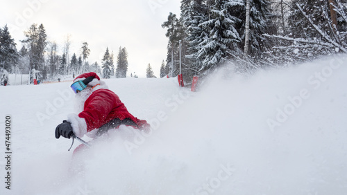 Santa Claus skiing downhill