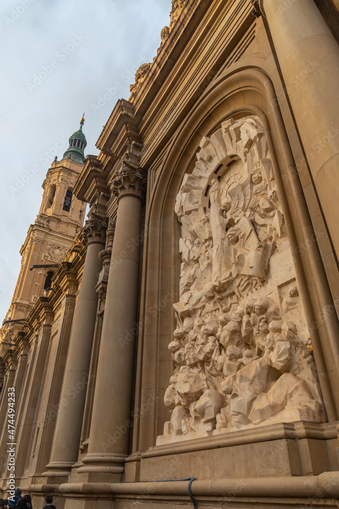 Exterior sculpture of the Basilica from the Plaza del Pilar in the city of Zaragoza at sunset, Aragon. Spain