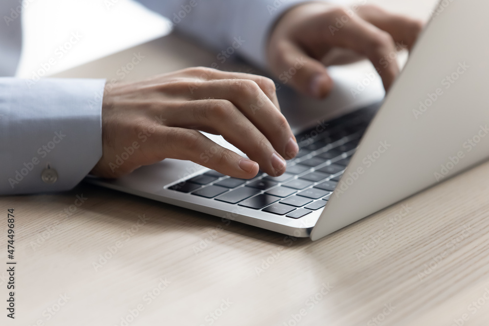 Businessman texting on laptop sit at workplace desk, close up. Freelancer do telework job, search information, web surfing internet pages, modern wireless tech usage, e-business apps, software concept Businessman texting on laptop sit at workplace desk, close up. Freelancer do telework job, search information, web surfing internet pages, modern wireless tech usage, e-business apps, software concept