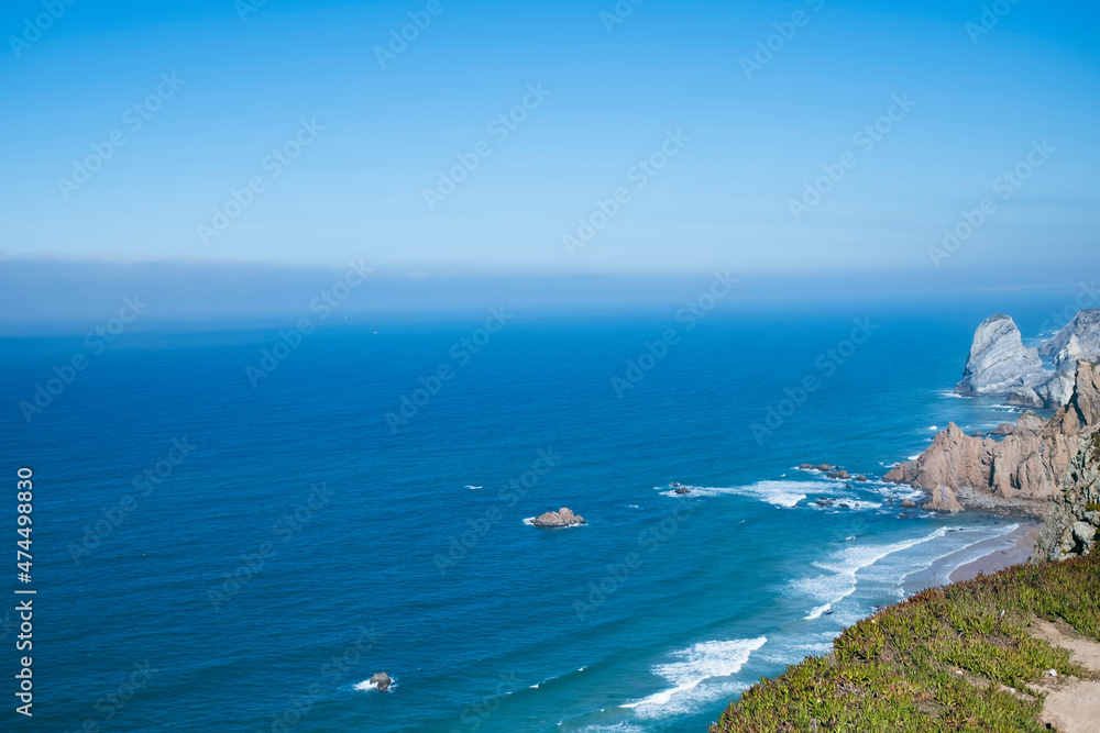 Cliffs and rocks at Atlantic ocean, beautiful bright landscape in the day light. Sintra, Portugal. Cliffs and rocks at Atlantic ocean, beautiful bright landscape in the day light. Sintra, Portugal.