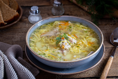 Chicken soup with homemade noodles, selective focus