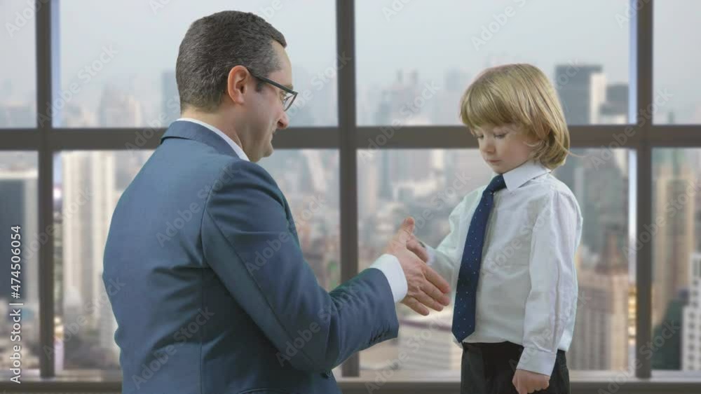 Father and son with suit shake hands, give five, different generation agreement Father and son with suit shake hands, give five, different generation agreement