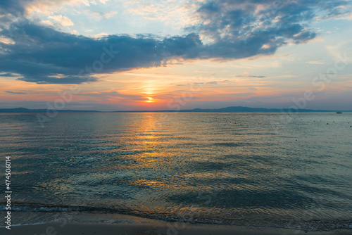 Evening sky with dramatic clouds over the sea. Dramatic sunset over the sea.