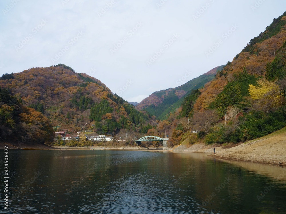the beautiful autumn leaves of lake okutama in Tokyo