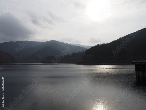 the beautiful autumn leaves of lake okutama in Tokyo photo