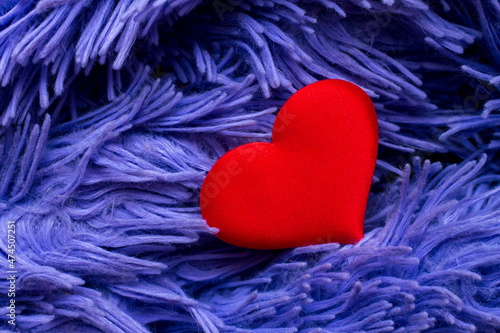 acid red textile heart on a shaggy lavender corduroy plaid  for the design of valentines and wedding invitations