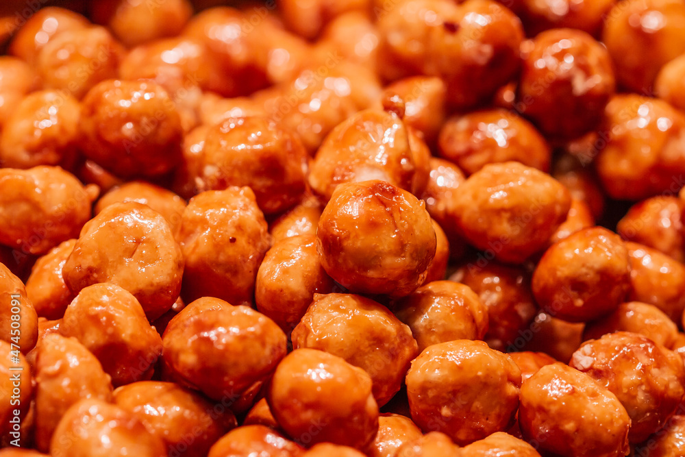 Caramelized peanuts with honey and sugar in the Boqueria market in Barcelona (Spain). Caramelized peanuts with honey and sugar in the Boqueria market in Barcelona (Spain).