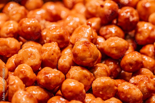 Caramelized peanuts with honey and sugar in the Boqueria market in Barcelona (Spain).
