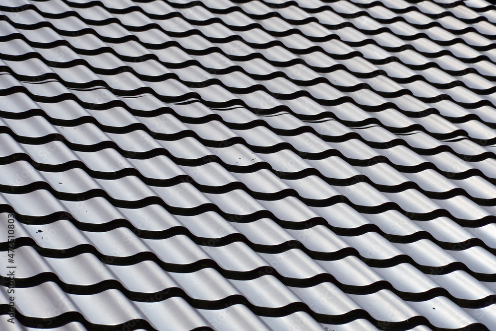 View of the new tiled roof. Blank background for text and design. Exterior of a country house. Copy space View of the new tiled roof. Blank background for text and design. Exterior of a country house. Copy space