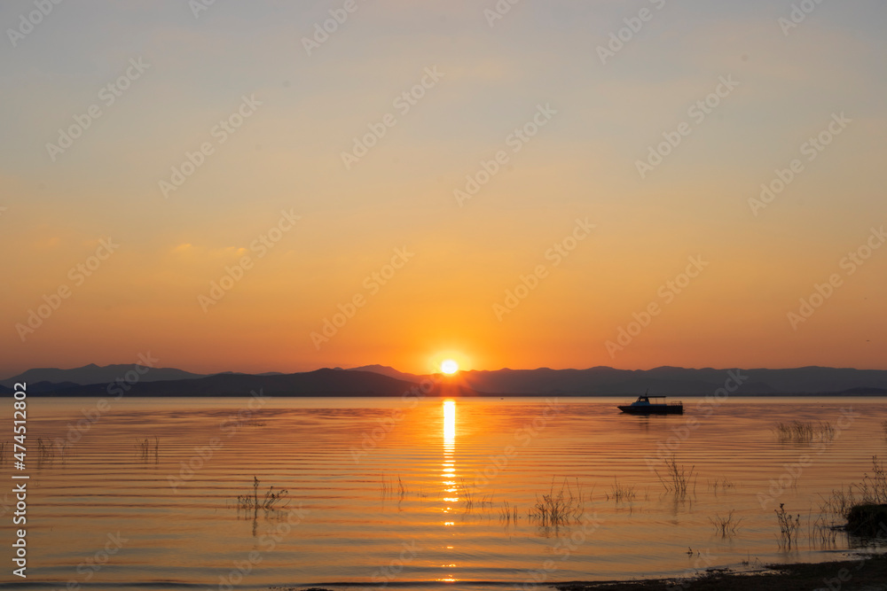 beautiful sunset, miracle moment, along row of mountain and lake in southeast Asia, nature landscape concept.