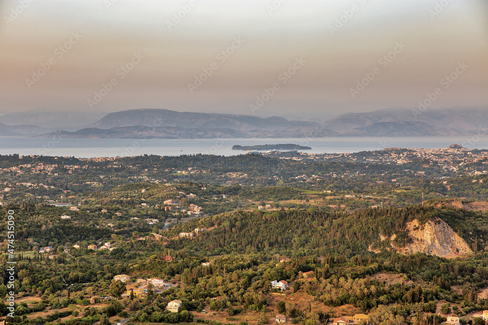 Sunset view over eastern coast of Corfu , Greece.