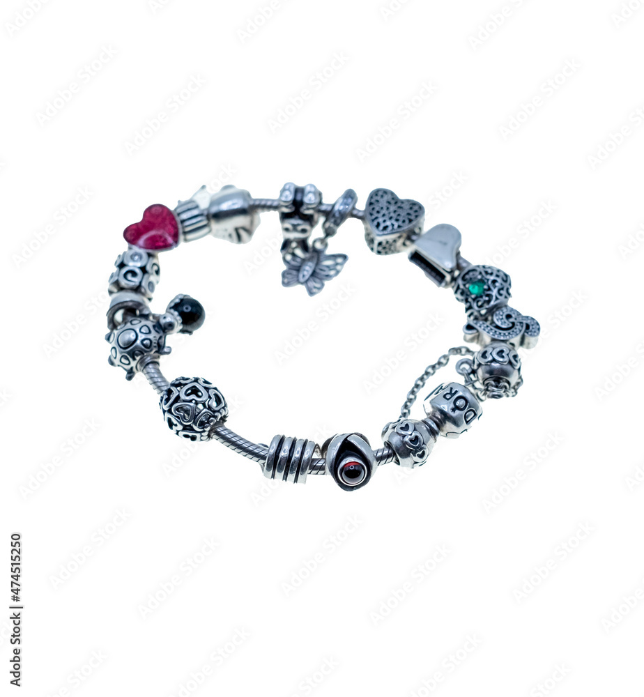 Norwich, Norfolk, UK – December 2021. Close up of a Pandora charm bracelet  with many Pandora charms