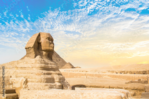 Great Sphinx against the background of the pyramids of the pharaohs Cheops  Khafren  and Mikerin in Giza  Egypt