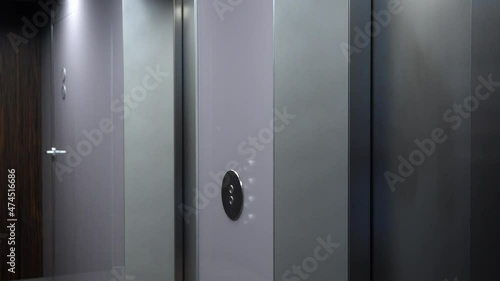 A hallway with an apartment door at the end