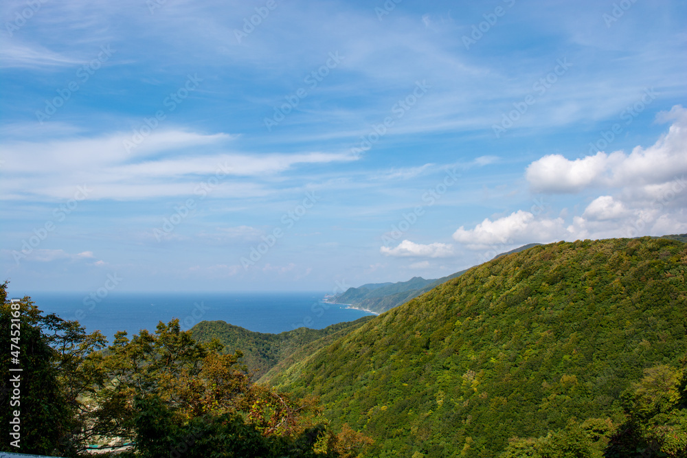 Beautiful sky, sea, rocky coast and mountain landscape in Akita, Tohoku, Japan Beautiful sky, sea, rocky coast and mountain landscape in Akita, Tohoku, Japan