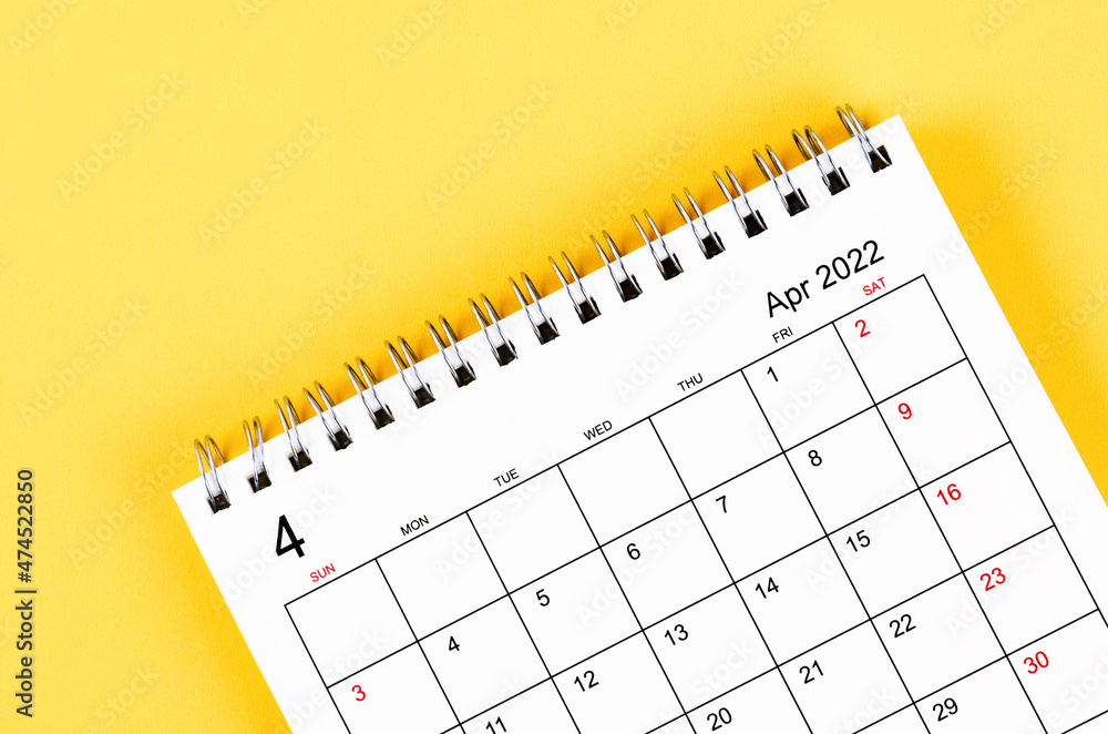 April 2022 desk calendar on yellow background. April 2022 desk calendar on yellow background.
