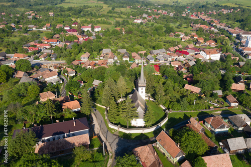 Aerial drone point of view of a whitewashed protestant church photo