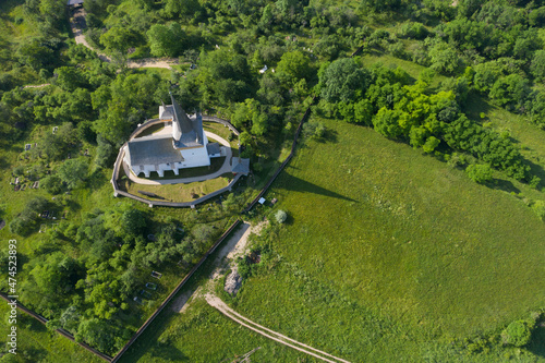 Aerial drone view of Valeni reformed church, Transylvania, Romania photo