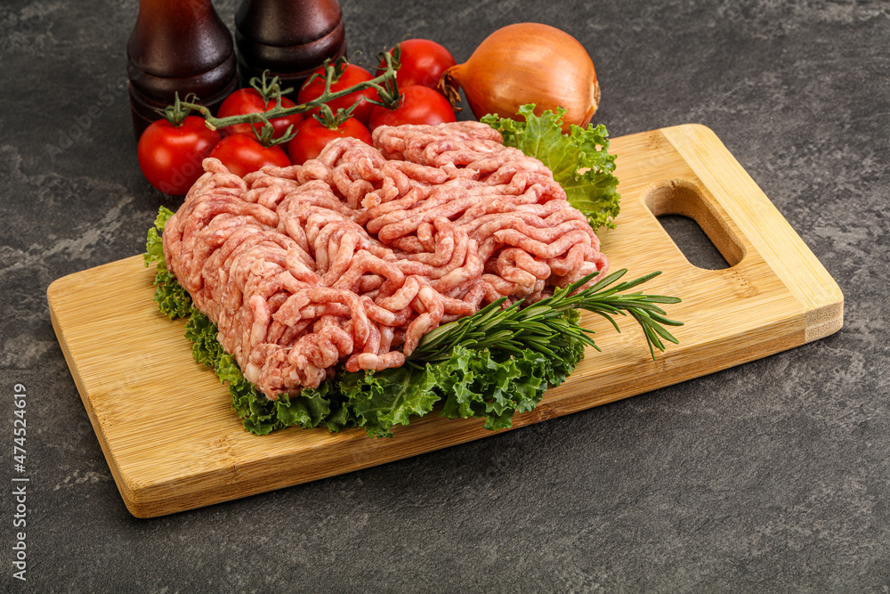 Raw pork minced meat over board Raw pork minced meat over board