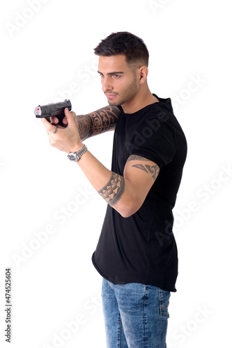Young man pointing gun, isolated on white