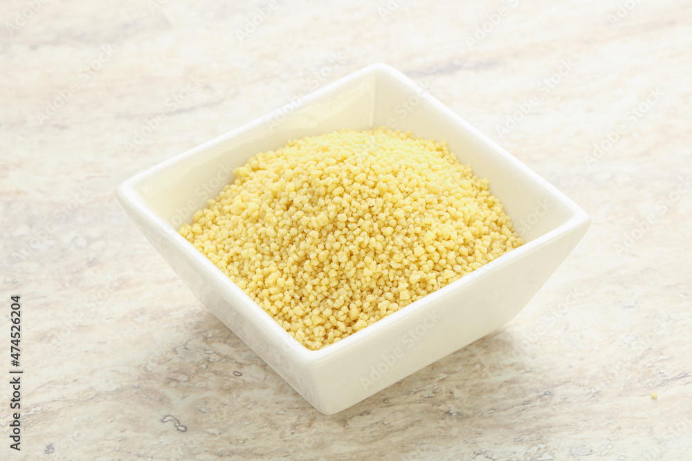 Raw couscous in the bowl Raw couscous in the bowl