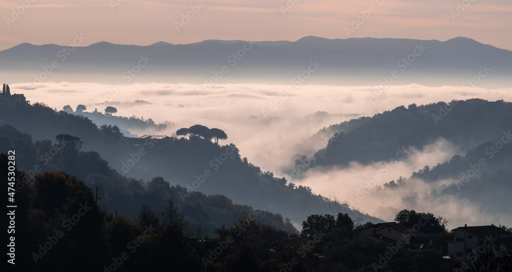 Misty landscape of the roman countryside, in the morning