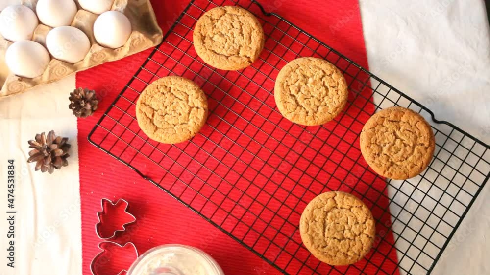 Home baking Christmas cookies. Child kid hand take a one cookie. Top view. Christmas New Year food tradition. Home baking Christmas cookies. Child kid hand take a one cookie. Top view. Christmas New Year food tradition.