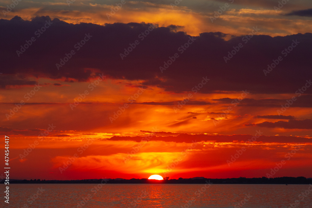Majestic red-orange sunset over the sea.