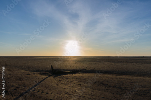 boat in a sunset on the beach