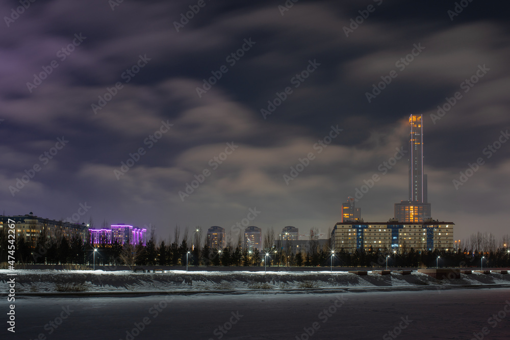 View of the left side Ishim river at night in Nur-Sultan, Kazakhstan.