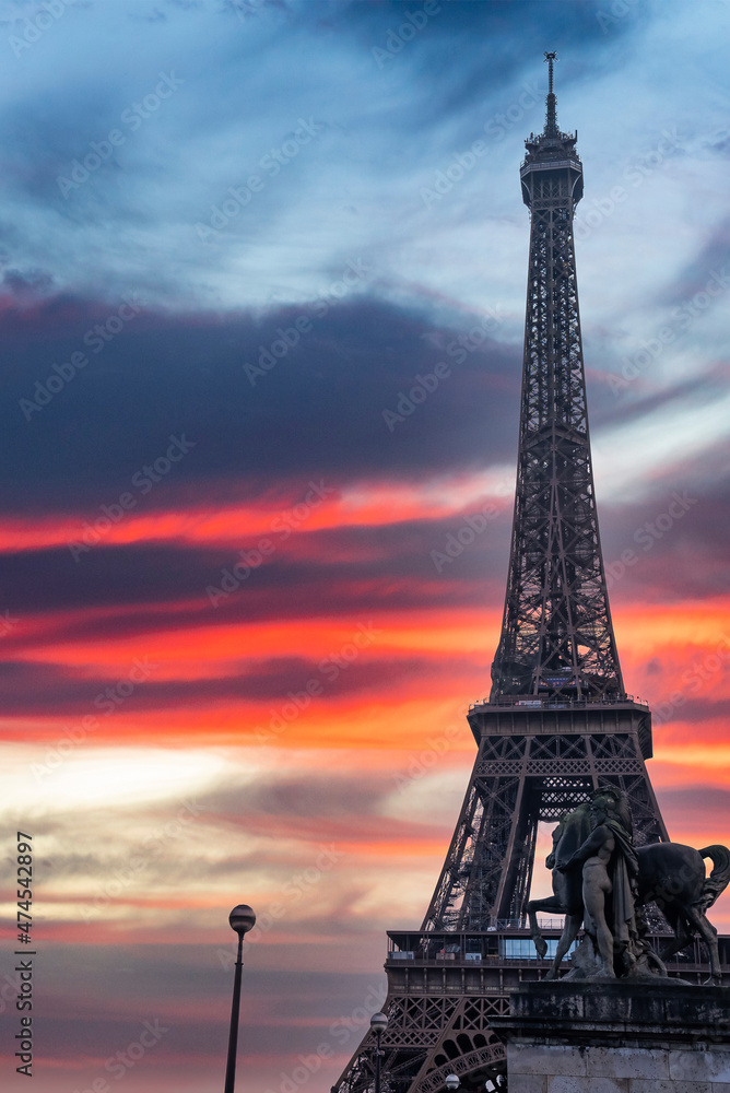 Naklejka premium Beautiful view of the famous Eiffel Tower in Paris, France during magical sunset. Best Destinations in Europe - Paris.