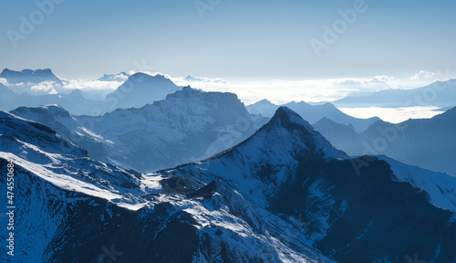 Mountains and clouds in the valley. Natural landscape high in the mountains.