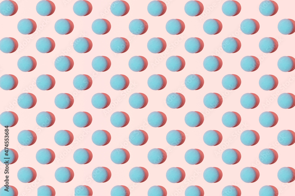 Baby blue balls against pastel pink background. Summer concept pattern.