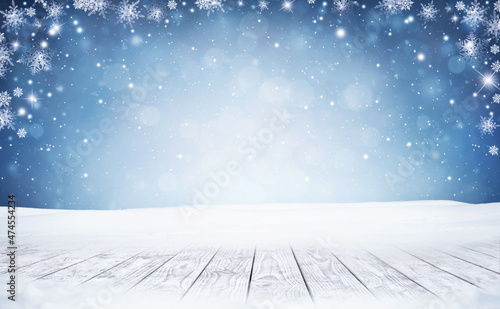 Winter Christmas scenic background with wooden table and copy space.