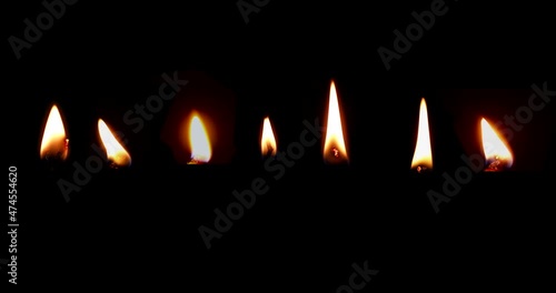 Realistic candle flame isolated against a dark (alpha) background. Footage has luma matte. 4k candle fire set