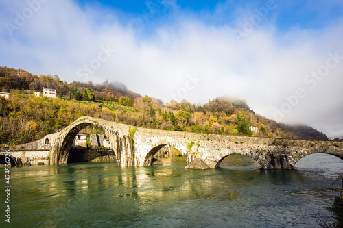 The bridge crosses the Serchio River.